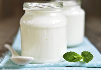 Homemade yogurt in a glass jar.