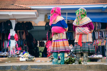 Hmong women at Bac Ha market in Northern Vietnam. Bac Ha is hilltribe market where people come to trade for goods in traditional costumes