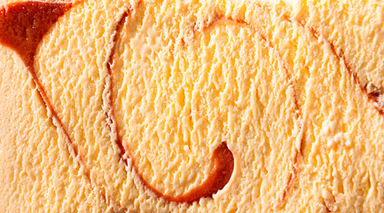 Horizontal caramel swirl ice cream close up