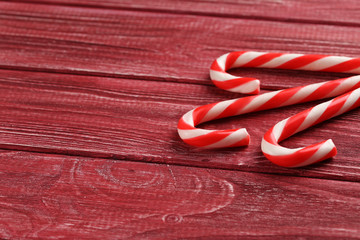 Christmas candy can on a red wooden table