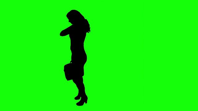 Silhouette of a woman on a green background.