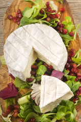 pomegranate seed with salad and camembert