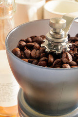 Manual coffee grinder with coffee beans