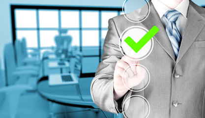business man touching, pressing modern button with green ticking Check Box.