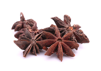 Star anise spice fruits and seeds isolated on white background
