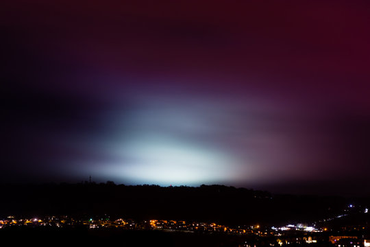 Light pollution from sports fields. A rainy night shows light from university pitches at night, above the City of Bath, UK