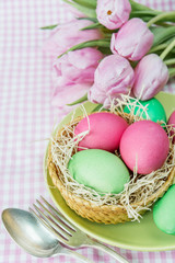 Basket with flowers and Easter eggs