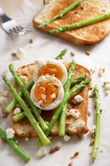 breakfast toast top with asparagus and soft boiled egg