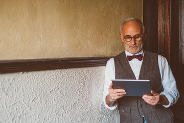 Older man using a tablet