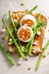 breakfast toast top with asparagus and soft boiled egg