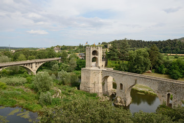 Fototapeta na wymiar Bridges across Fluvia River in Besalu, Catalonia, Spain.