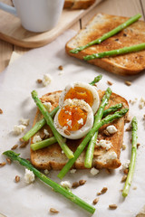 Fototapeta na wymiar breakfast toast top with asparagus and soft boiled egg