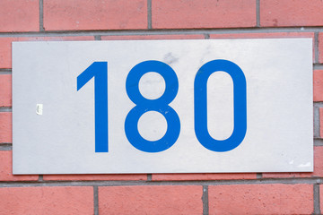 House number 180 sign