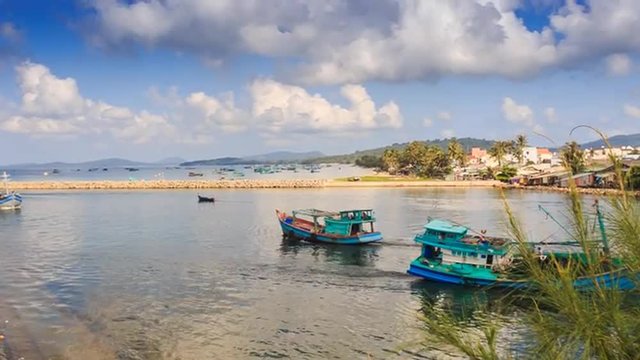 Fishing Boats Drift to-and-fro in Bay Resort City Hills Sky