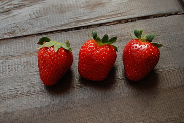 Group of red ripe strawberries, centered, close-up