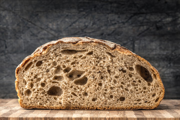 Half of rye bread on table