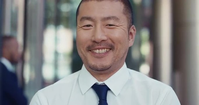 Portrait of Japanese Businessman outside corporate office building