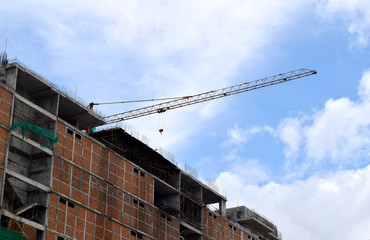 Construction cranes and Buildings and sky background