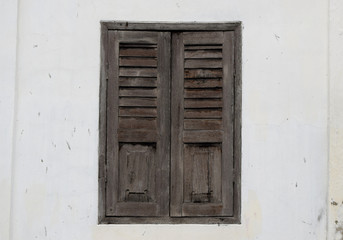 Fototapeta na wymiar Brown Wood Window on cement wall at home