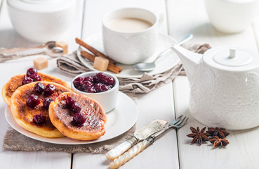 Cottage cheese pancakes with cherry sauce