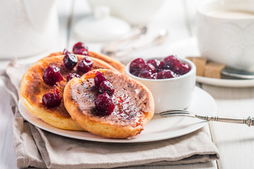 Cottage cheese pancakes with cherry sauce