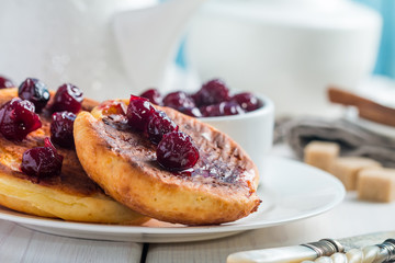 Cottage cheese pancakes with cherry sauce