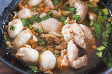Close up of a bowl of Chinese style beef noodle soup.