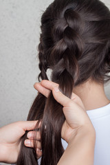 Fototapeta premium weave braid girl in a hair salon