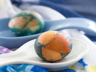 Easter eggs in blue Japanese soup spoon
