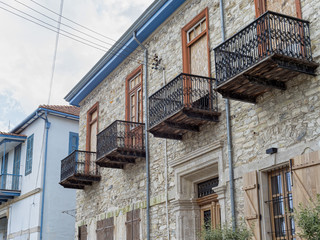 Fototapeta na wymiar Vintage stone house with balconies. Pano Lefkara. Cyprus. 