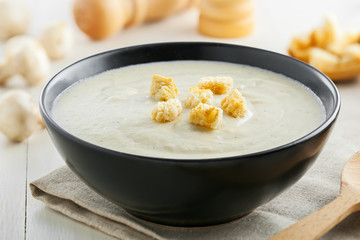 Mushroom cream soup on a table, delicious French food for lunch