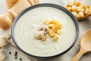 Fresh mushroom cream soup, French traditional food, close-up