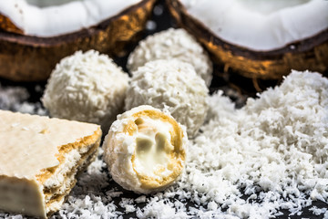 Coconut balls in coconut flakes and coconut wafer