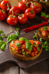 Italian bruschetta with roasted tomatoes and garlic