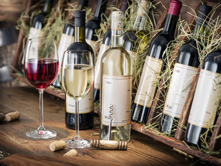 Wine bottles on the wooden shelf. © volff