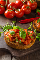 Italian bruschetta with roasted tomatoes and garlic