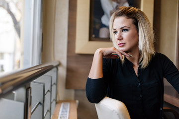 Beautiful woman looking out the window