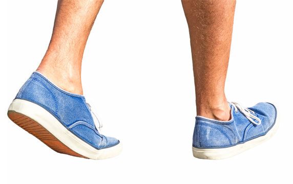 Walking man with blue shoes