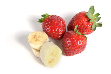 Strawberries and bananas on a white background