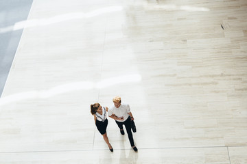 Business couple walking together