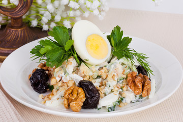 vegetarian salad with prunes and walnuts