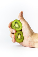 Hand holding kiwifruit