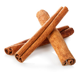 Cinnamon sticks close-up isolated on white background.