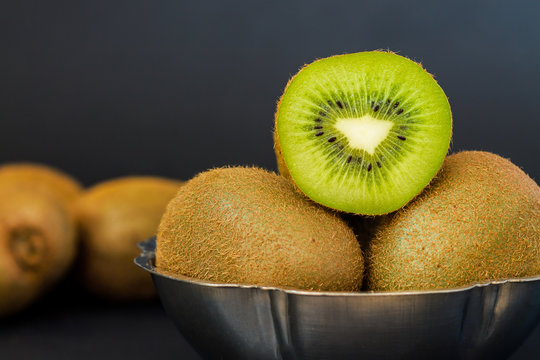 Kiwifruit on dark background