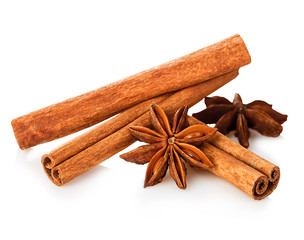 Cinnamon stick and star anise spice close-up isolated on white background.
