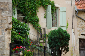 Fototapeta na wymiar FLAVIGNY-SUR-OZERAIN, FRANCE - CIRCA AUGUST, 2015: Beautiful street in Flavigny-sur-Ozerain, little village in Burgundy, France