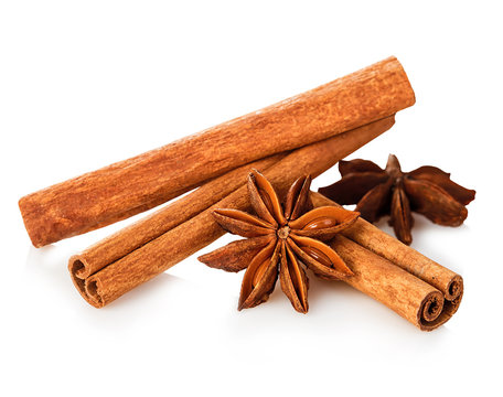 Cinnamon stick and star anise spice close-up isolated on white background.
