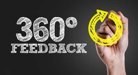 Hand writing the text: 360° Feedback
