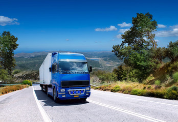 Fototapeta na wymiar truck carrying loads on a mountain road