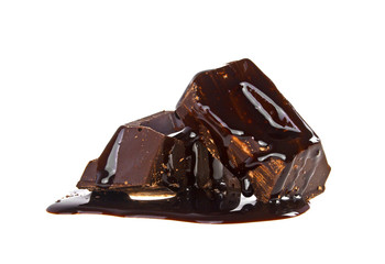 Slices dark chocolate bar poured chocolate isolated on white bac